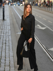 Calças pretas com lantejoulas laterais