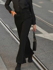 Calças pretas com lantejoulas laterais